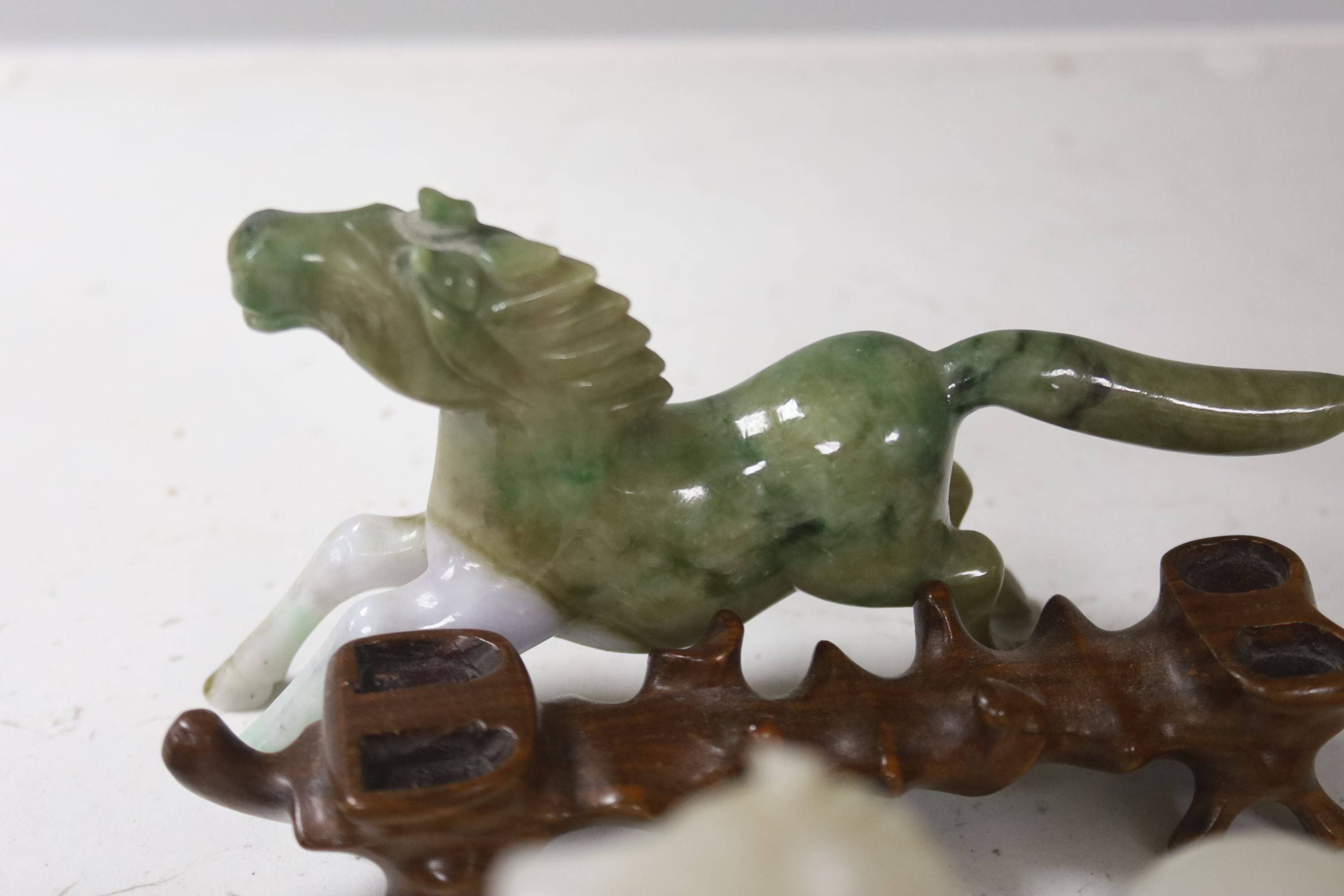 Eight Chinese 20th century carved hardstone 'Horses of Mu Wang'